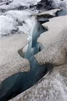 Education tour on the glacier Kverkjokull: some cracks partially hidden by the snow